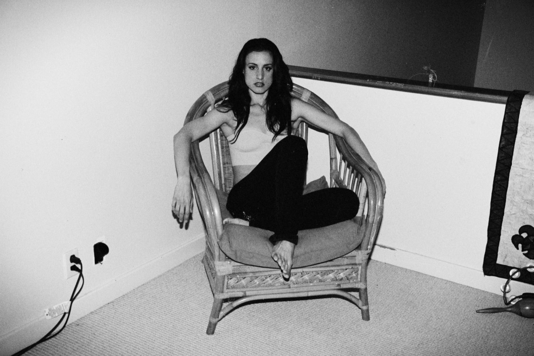 Black-and-white seated portrait