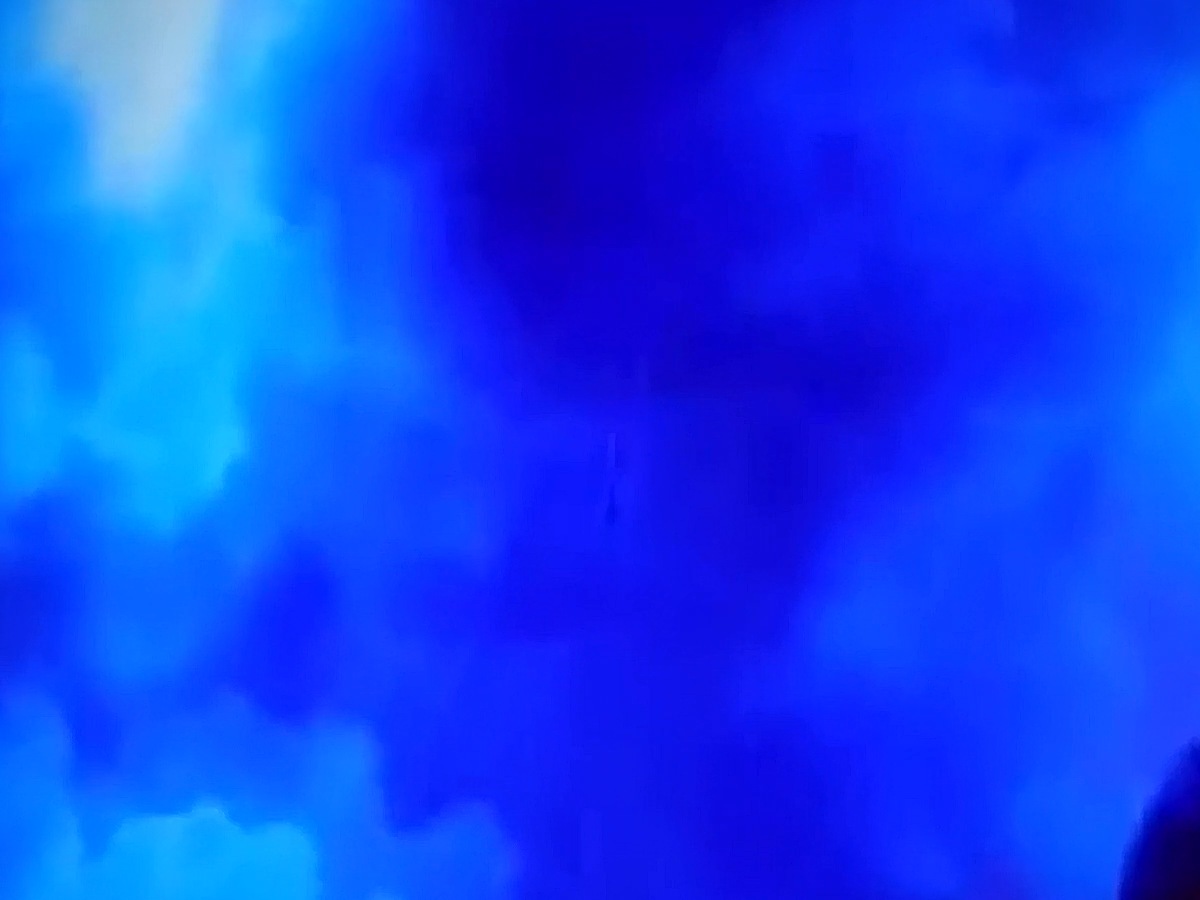 Digital art — the head dissolved completely into a wall of clouds